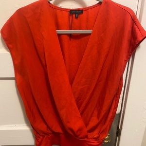 Low cut red bodysuit